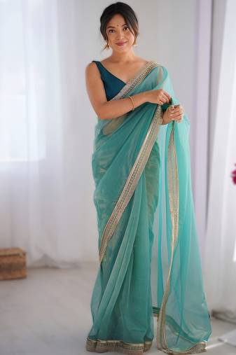 Sky blue exclusive designer dual shade gold net sequins saree with lace border