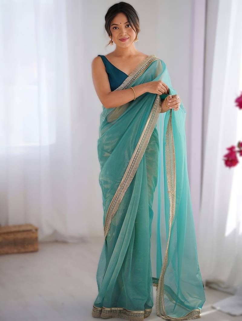 Sky blue exclusive designer dual shade gold net sequins saree with lace border