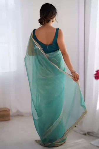 Sky blue exclusive dual shade gold net sequins saree with lace border