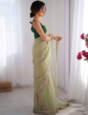 Green exclusive dual shade gold net sequins saree with lace border 3