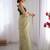 Green exclusive designer dual shade gold net sequins saree with lace border