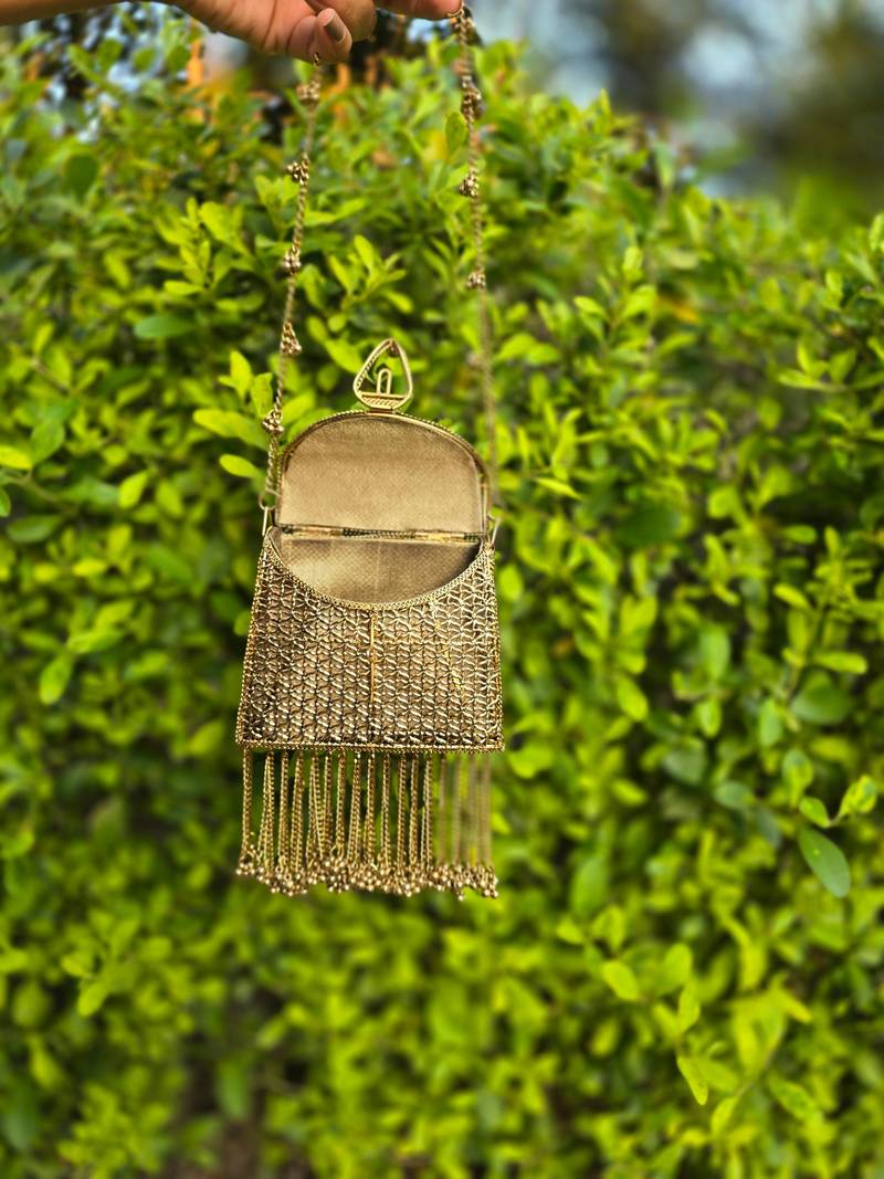 Noor tassel minaudière clutch bag gold