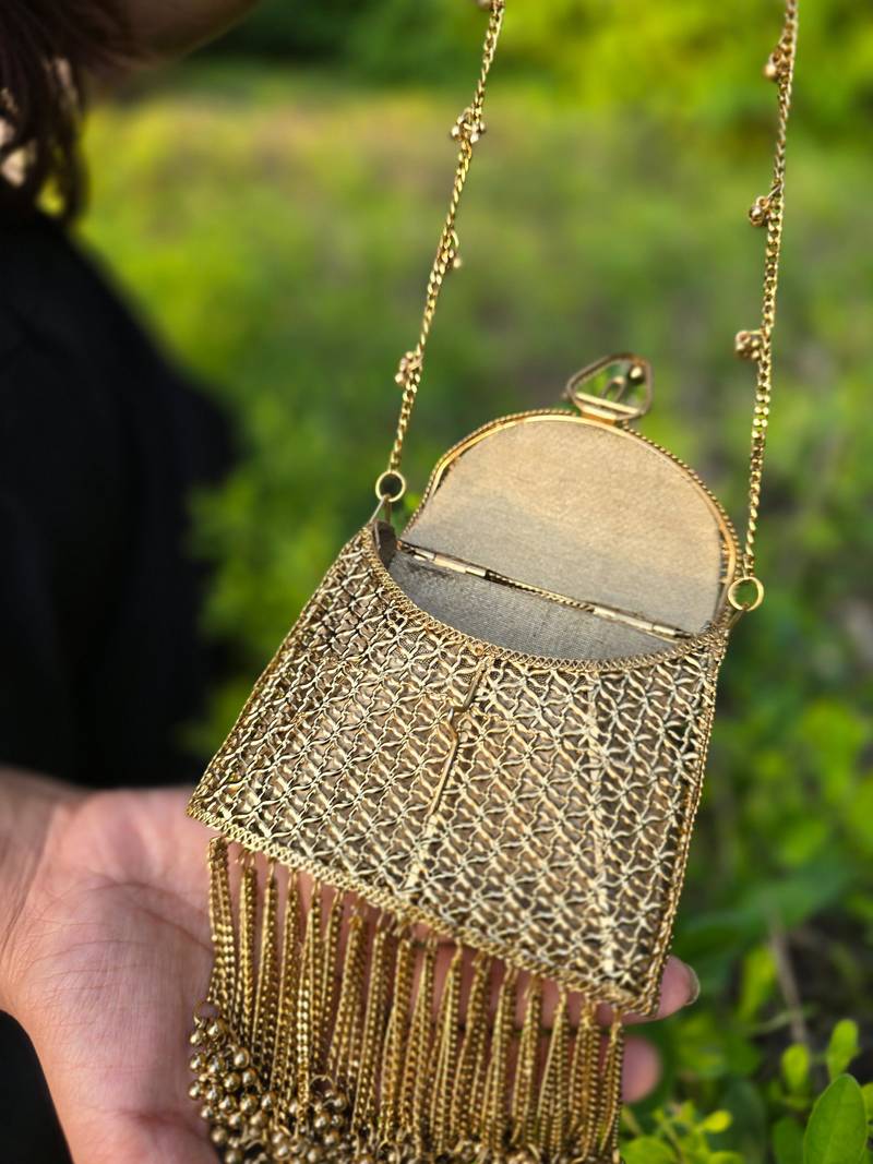 Noor tassel minaudière clutch bag gold