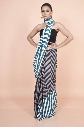 Multi coloured  geomatric styled digital printed crepe saree with blouse