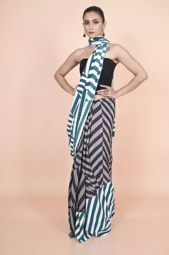 Multi coloured  geomatric styled digital printed crepe saree with blouse