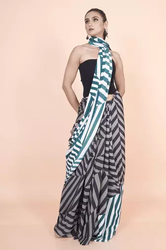 Multi coloured  geomatric styled digital printed crepe saree with blouse