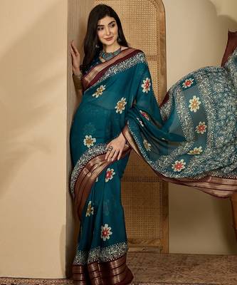 Women's teal chiffon printed saree with unstitched blouse piece 1