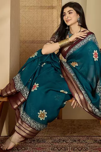 Women's teal chiffon printed saree with unstitched blouse piece