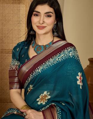 Women's teal chiffon printed saree with unstitched blouse piece 4