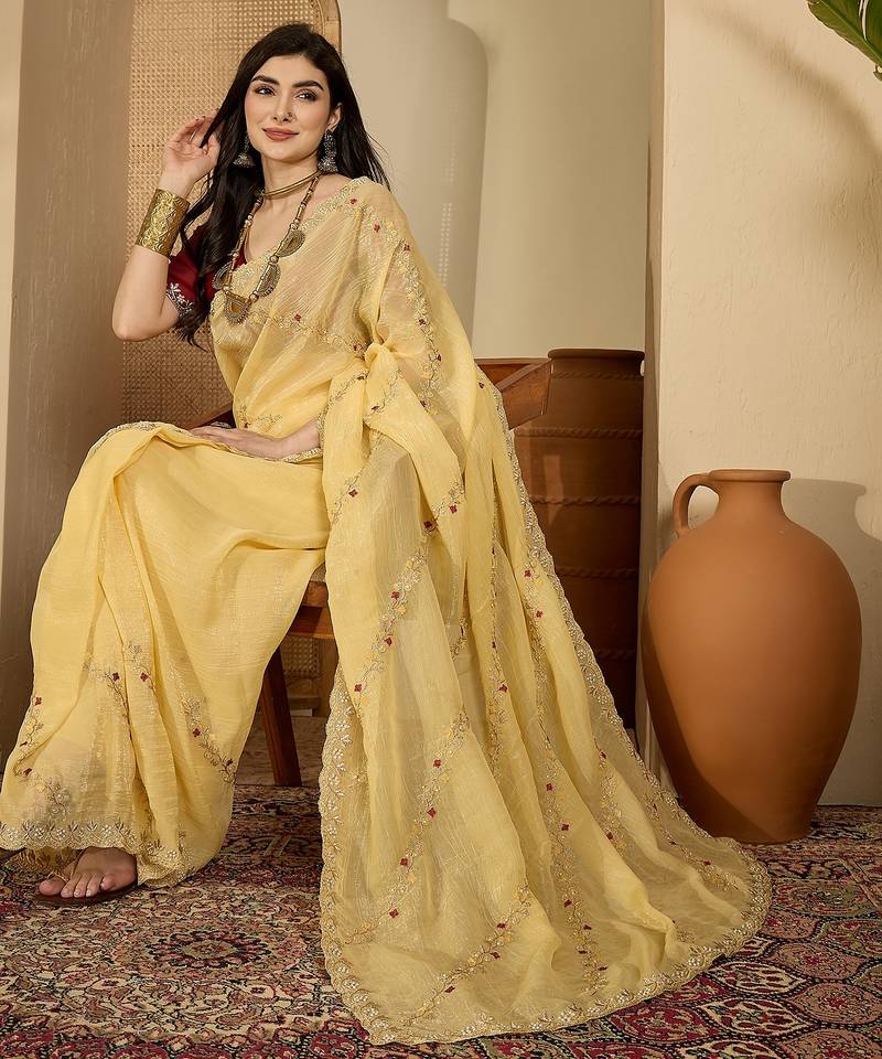 Women's yellow chiffon embroidered saree with unstitched blouse piece