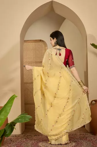 Women's yellow chiffon embroidered saree with unstitched blouse piece