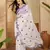 Women's white chiffon embroidered saree with unstitched blouse piece