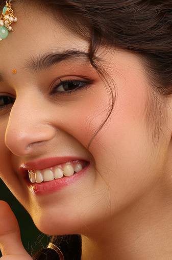 Gold plated kundan green stones maang tikka