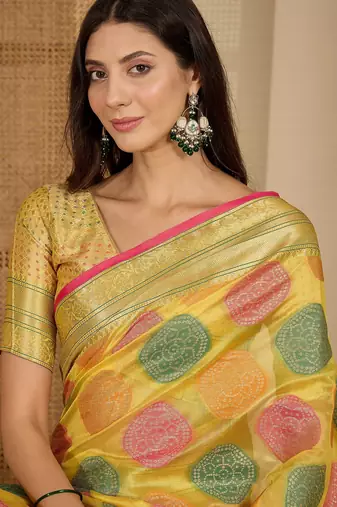 Women's yellow organza zari woven saree with unstitched blouse piece