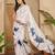 Women's off white crepe printed saree with unstitched blouse piece