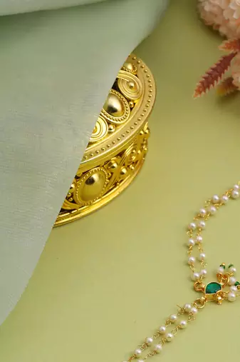 Gold plated kundan green stones haath phool
