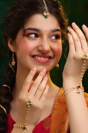 Gold plated kundan green stones earrings