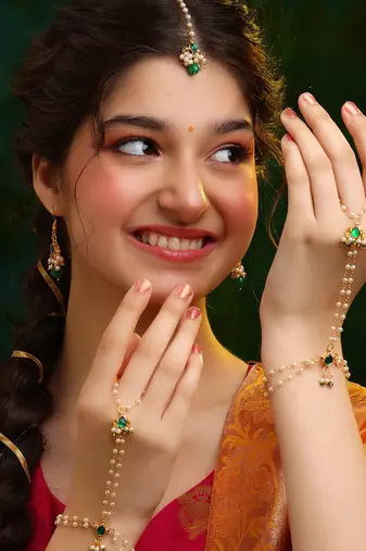 Gold plated kundan green stones earrings