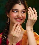 Gold plated kundan green stones earrings