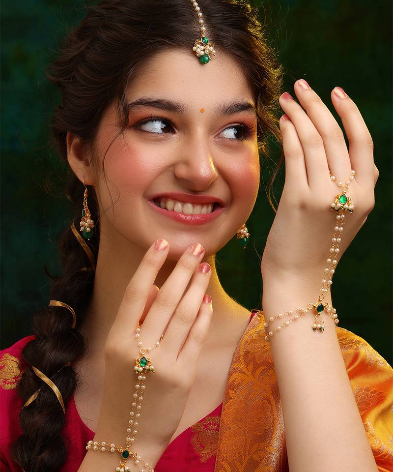 Gold plated kundan green stones earrings
