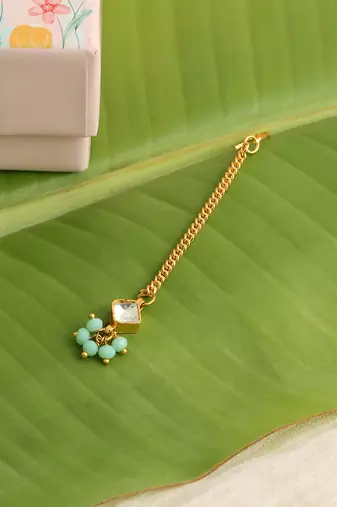 Gold plated kundan green stones maang tikka