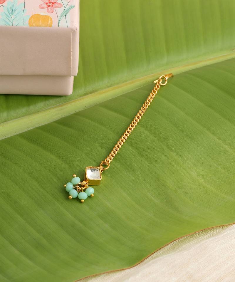 Gold plated kundan green stones maang tikka