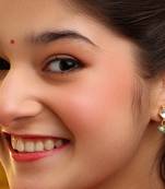 Gold plated kundan green stones earrings