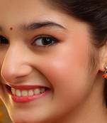 Gold plated kundan orange stones earrings