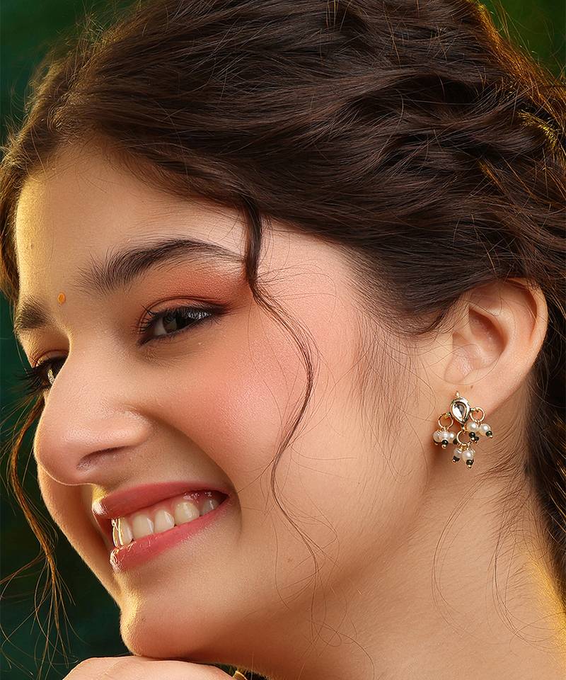 Gold plated kundan green stones earrings