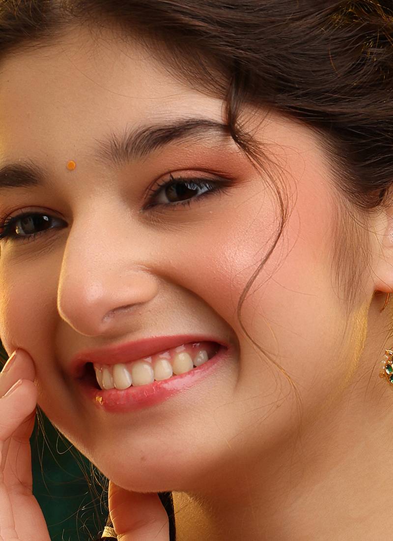 Gold plated kundan green stones earrings