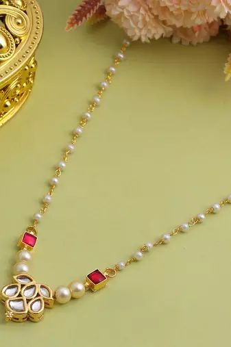 Gold plated kundan maroon stones necklace