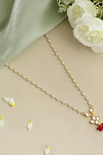 Gold plated kundan maroon stones necklace