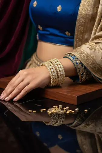 Teardrop stone-encased gold bangles