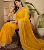 Women's gold georgette bandhni saree with unstitched blouse piece