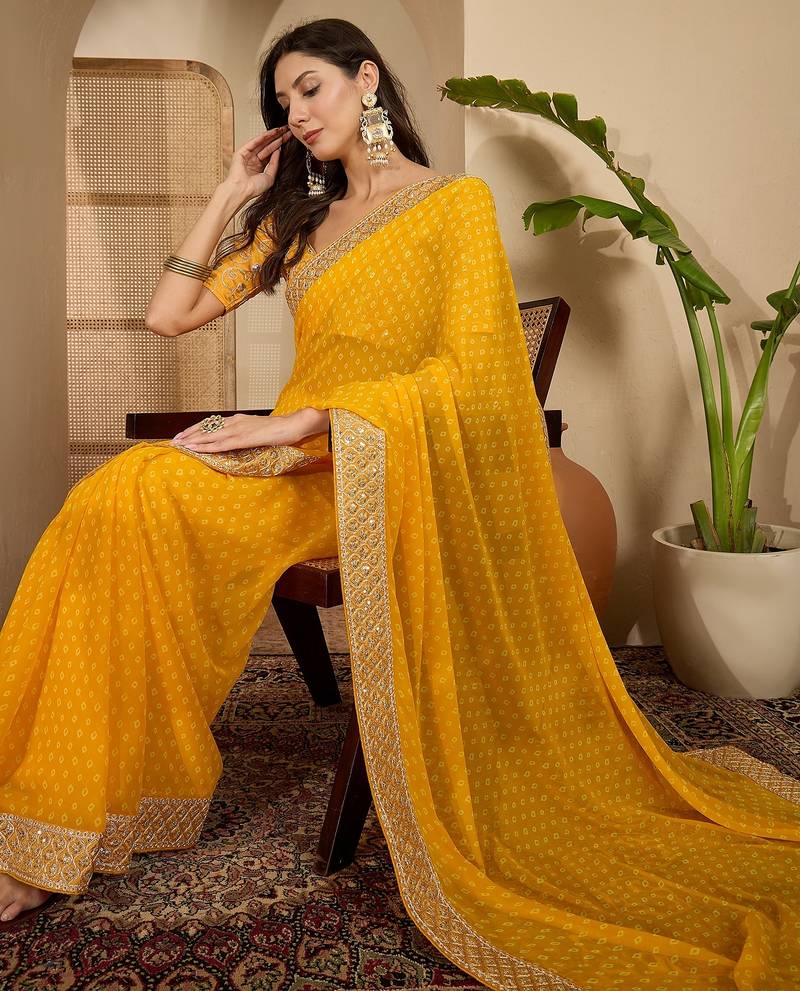 Women's gold georgette bandhni saree with unstitched blouse piece