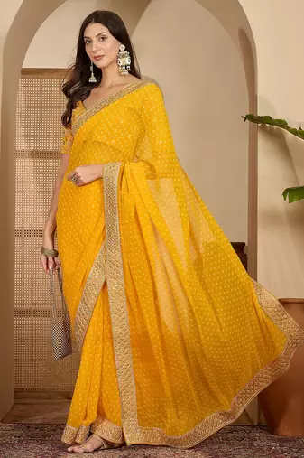 Women's gold georgette bandhni saree with unstitched blouse piece