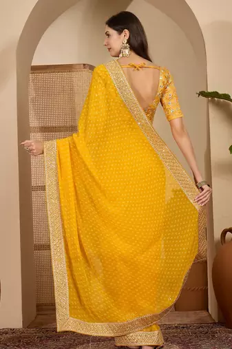 Women's gold georgette bandhni saree with unstitched blouse piece