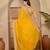 Women's gold georgette bandhni saree with unstitched blouse piece