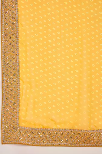 Women's gold georgette bandhni saree with unstitched blouse piece