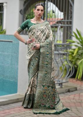 Green banarasi silk blend saree in ajrakh and patola weaving with zari pallu 1