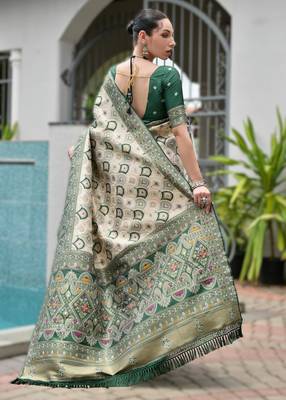 Green banarasi silk blend saree in ajrakh and patola weaving with zari pallu 2