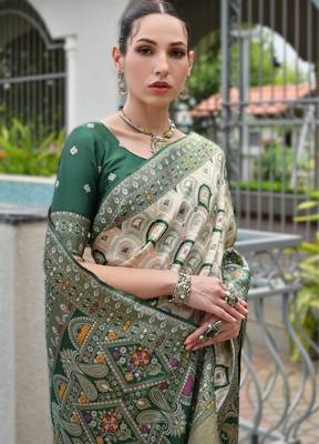 Green banarasi silk blend saree in ajrakh and patola weaving with zari pallu 3