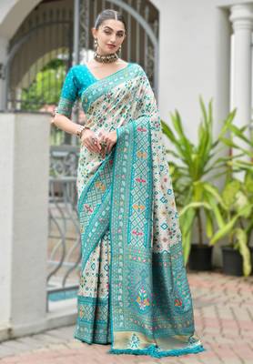 Sky blue banarasi silk blend saree in ajrakh and patola weaving with zari pallu 1