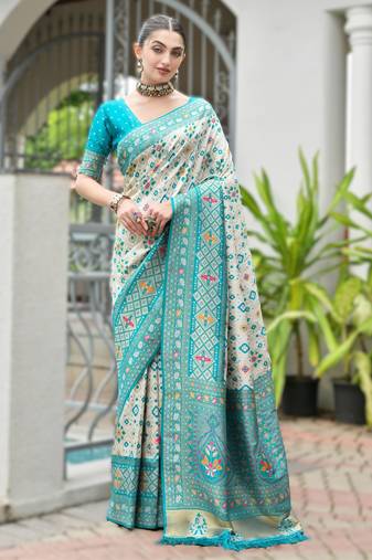 Sky blue banarasi silk saree in ajrakh and patola weaving with zari pallu