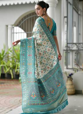 Sky blue banarasi silk blend saree in ajrakh and patola weaving with zari pallu 2