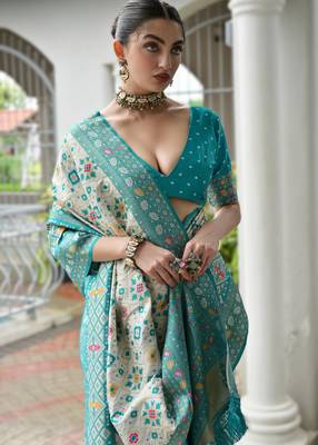 Sky blue banarasi silk blend saree in ajrakh and patola weaving with zari pallu 3