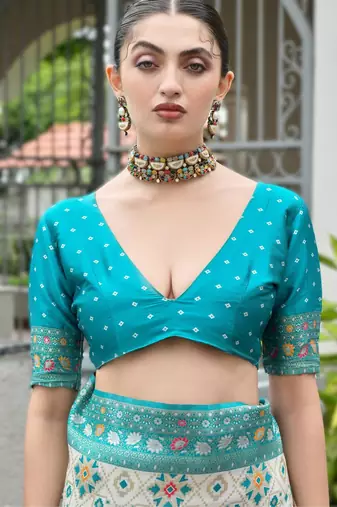 Sky blue banarasi silk blend saree in ajrakh and patola weaving with zari pallu