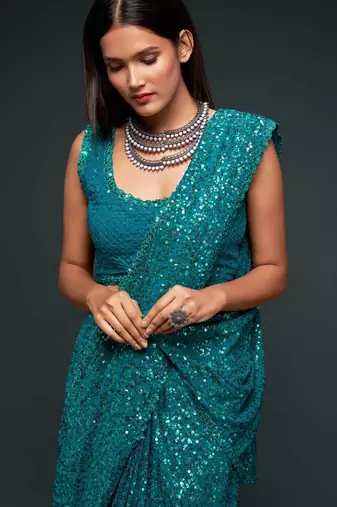 Teal blue georgette saree with thread & multiple sequins embroidery