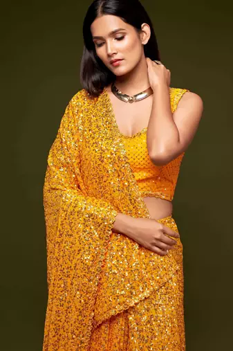 Yellow georgette saree with thread & multiple sequins embroidery