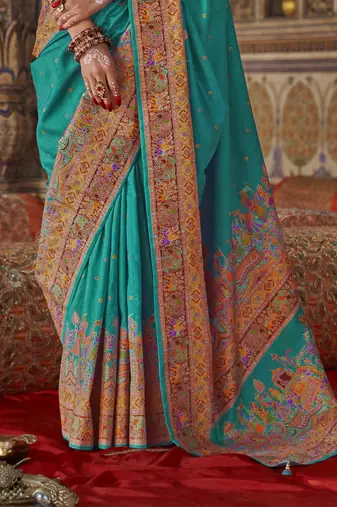 Turquoise silk blend printed saree with unstitched blouse piece